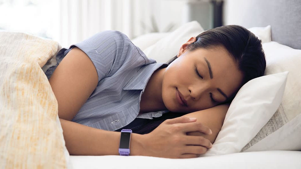  Woman asleep wearing Fitbit 