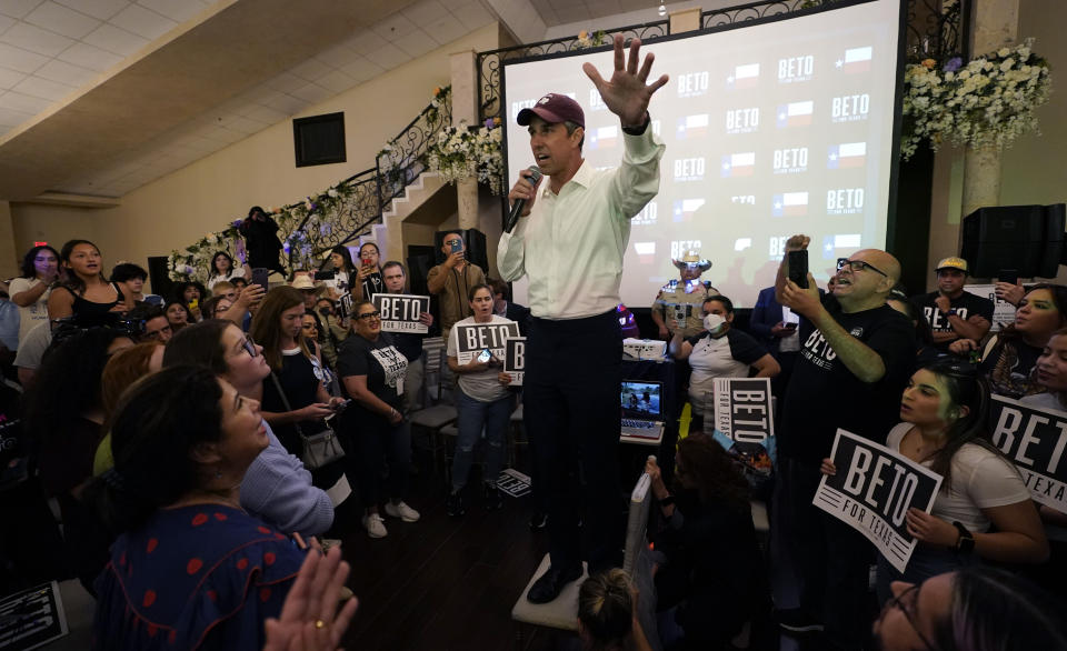 Texas Democratic gubernatorial candidate Beto O'Rourke, center, stands on a chair as he talks to supporters, Friday, Sept. 30, 2022, in Edinburg, Texas. As Democrats embark on another October blitz in pursuit of flipping America's biggest red state, Republicans are taking a swing of their own: Making a play for the mostly Hispanic southern border on Nov. 8 after years of writing off the region that is overwhelmingly controlled by Democrats. (AP Photo/Eric Gay)