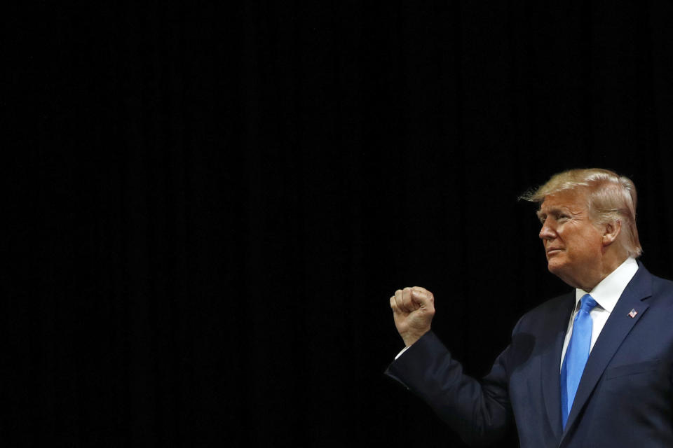 President Donald Trump walks onstage to speak at the Israeli American Council National Summit in Hollywood, Fla., Saturday, Dec. 7, 2019. (AP Photo/Patrick Semansky)