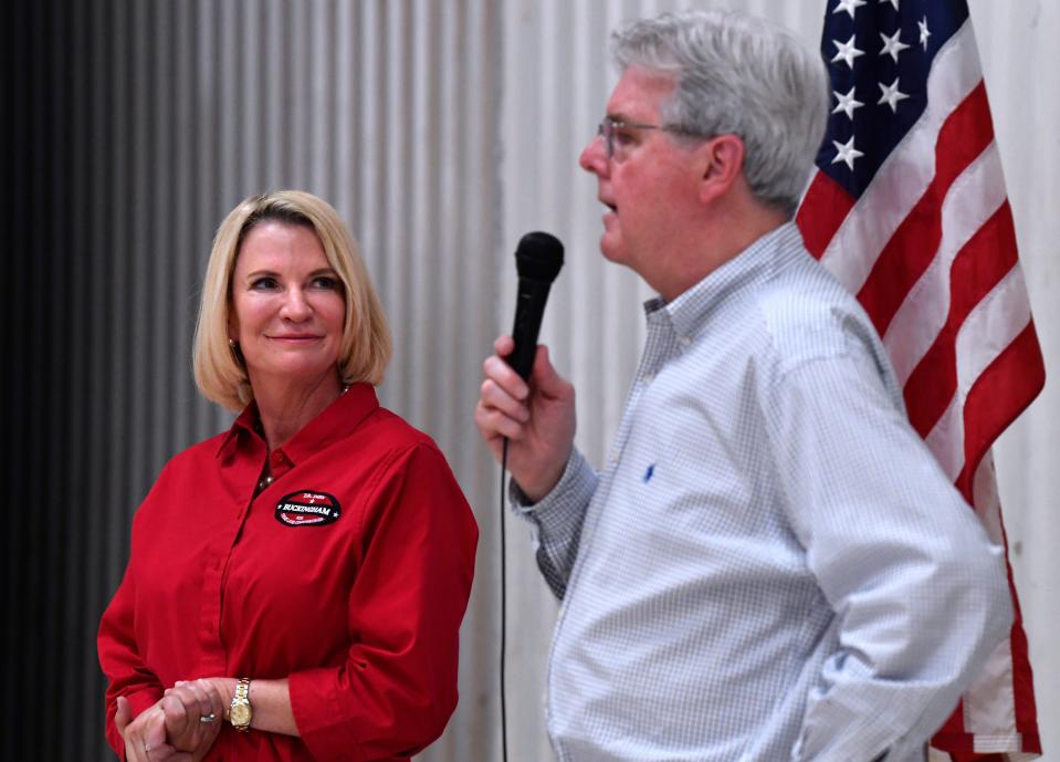 State Sen. Dawn Buckingham listens to Lt. Gov. Daniel Patrick as the two answer questions from a group of more than two dozen during a campaign program at Abilene Aero on Wednesday. Buckingham is in the Republican primary runoff against Tim Westley.