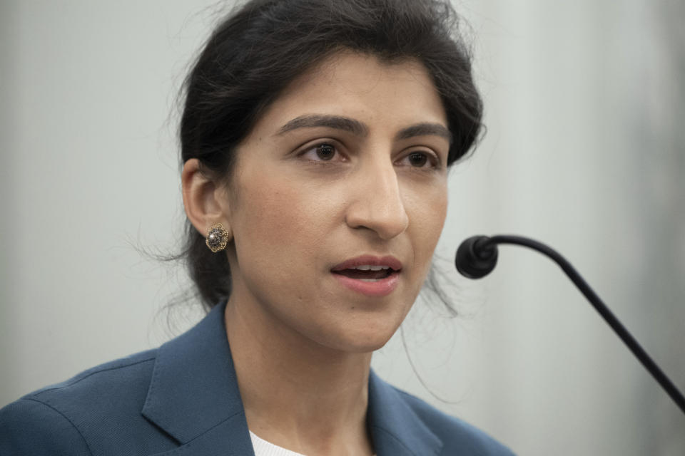 FILE - In this April 21, 2021 file photo, Lina Khan, nominee for Commissioner of the Federal Trade Commission (FTC), speaks during a Senate Committee on Commerce, Science, and Transportation confirmation hearing on Capitol Hill in Washington.  Amazon is asking for Khan, the new head of the Federal Trade Commission to step aside from antitrust investigations into the e-commerce giant. The company contends, Wednesday, June 30,  that Khan's public criticism of Amazon's market power makes it impossible for her to be impartial. (Saul Loeb/Pool via AP)