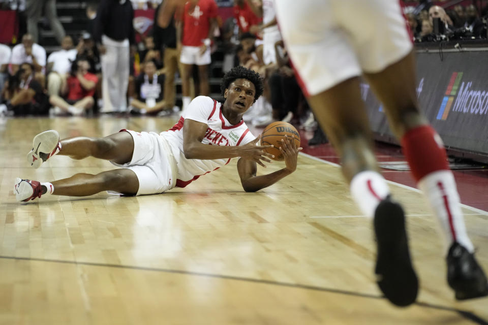 Houston Rockets' Amen Thompson scrambles for the ball against the Portland Trail Blazers during the first half of an NBA summer league basketball game Friday, July 7, 2023, in Las Vegas. (AP Photo/John Locher)