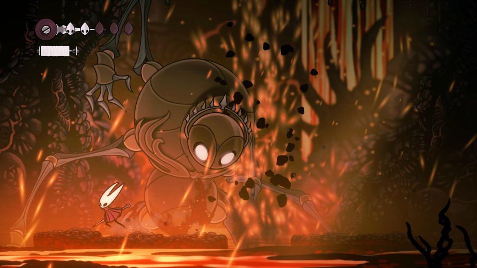 Hollow Knight: Silksong — a screenshot of a large, crowned enemy looming over Hornet in a room full of lava and ash.