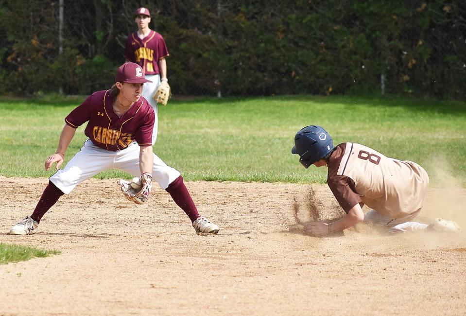 Case shortstop Adam Gracie is late attempting a tag on Westport 
 runner Max Gallant, who was safe at second.