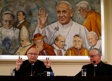 Chilean bishops Luis Fernando Ramos Perez and Juan Ignacio Gonzalez Errazuriz attend a news conference ahead of three days of closed-door, crisis meetings with Pope Francis at the Vatican, May 14, 2018. REUTERS/Yara Nardi