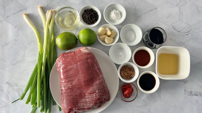 steak with scallions and seasonings for lok lak stir-fry
