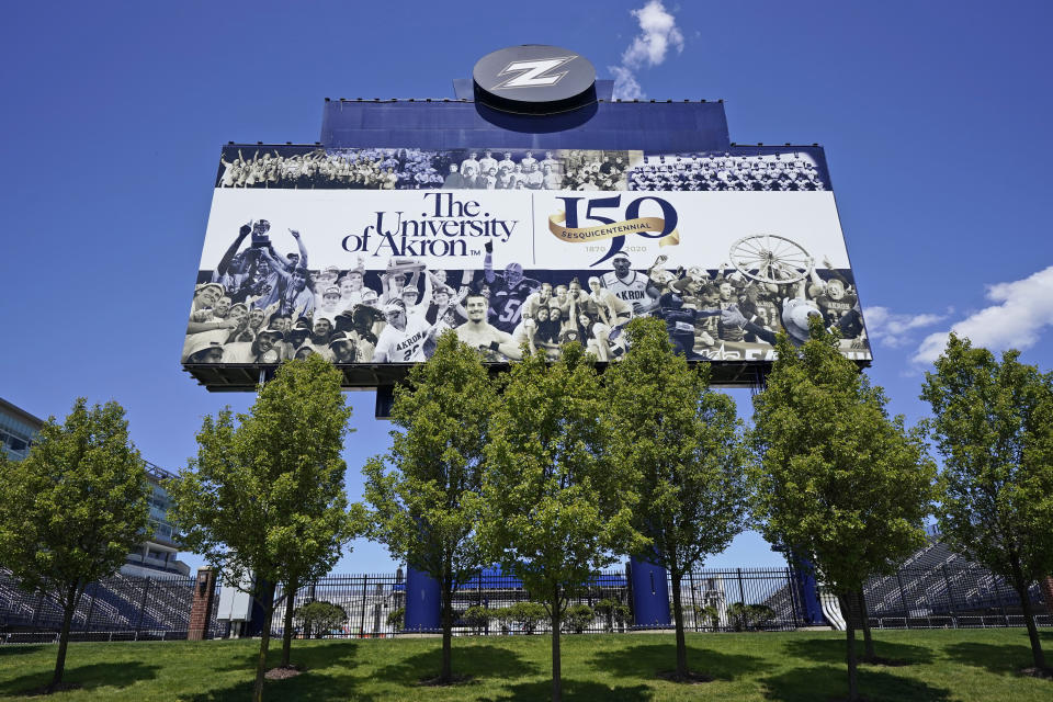 A billboard at the University of Akron is displayed, Thursday, May 13, 2021, in Akron, Ohio. Ohio Gov. Mike DeWine recently announced a weekly $1 million prize and full-ride college scholarships to entice more Ohioans to get the COVID-19 vaccine. (AP Photo/Tony Dejak)