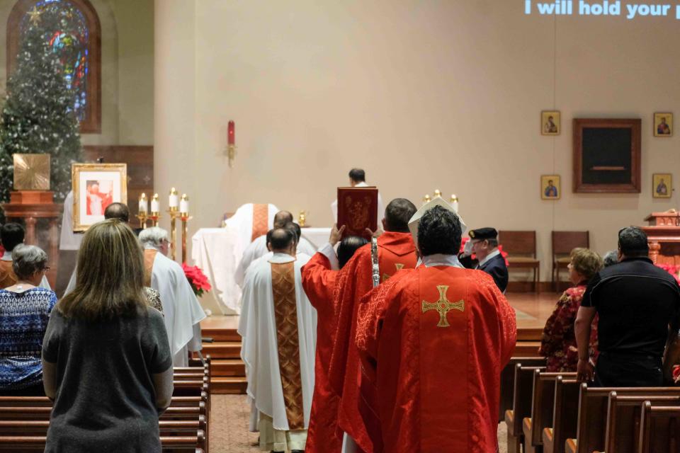 The penitential procession makes its way down the aisle Monday at the mass for Pope Emeritus Benedict XVI at St. Mary's Cathedral in Amarillo.