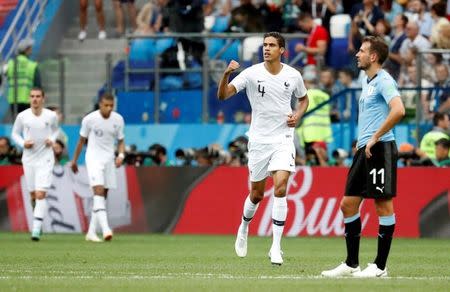 Soccer Football - World Cup - Quarter Final - Uruguay vs France - Nizhny Novgorod Stadium, Nizhny Novgorod, Russia - July 6, 2018 France's Raphael Varane celebrates scoring their first goal REUTERS/Damir Sagolj