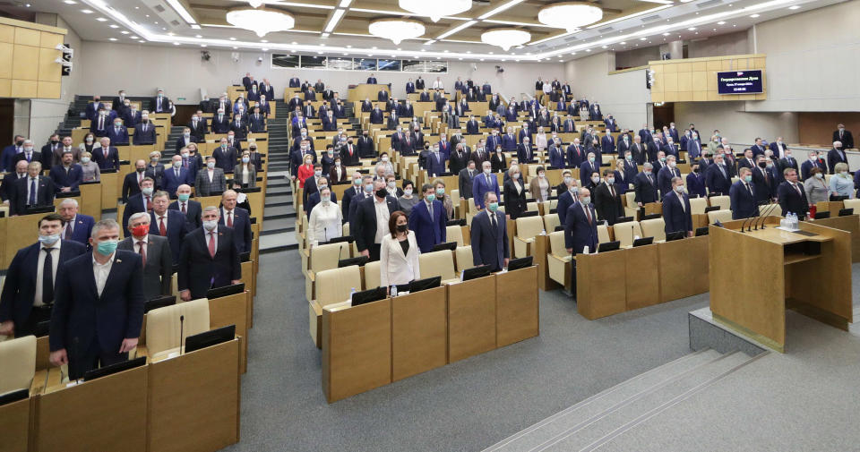 In this photo provided by the State Duma, deputies attend a session at the State Duma, the Lower House of the Russian Parliament in Moscow, Russia, Wednesday, Jan. 27, 2021. Both houses of parliament voted unanimously Wednesday to extend New START treaty for five years, a fast-track move that comes days before the last remaining U.S.-Russian arms control pact is due to expire. (The State Duma, The Federal Assembly of The Russian Federation via AP)