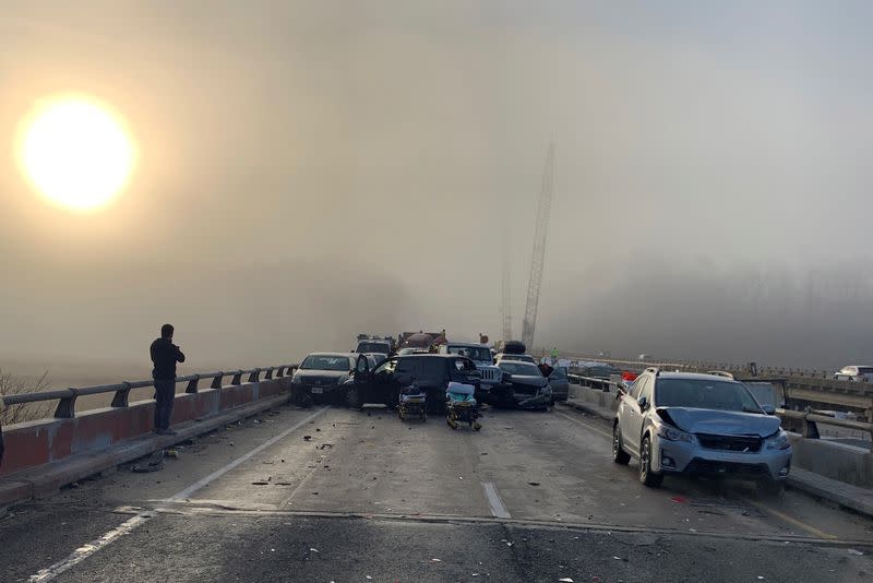 Damaged vehicles are seen after a chain reaction crash on I-64 in York County, Virginia