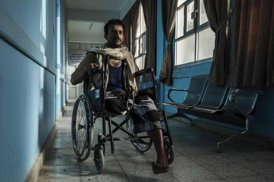 Yemeni fighter 42-year-old Sam Saleh Abdullah, who was severely injured and had his right leg amputated from clashes with Houthi rebels, stops for a photograph, at the Marib Hospital in Yemen, Monday, June 21, 2021. On the most active front line in Yemen's long civil war, the months-long battle for the city of Marib has become a dragged-out grind with a steady stream of dead and wounded from both sides. (AP Photo/Nariman El-Mofty)