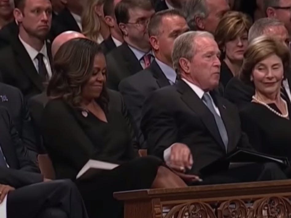 Bush hands Obama a cough drop at John McCain's memorial.