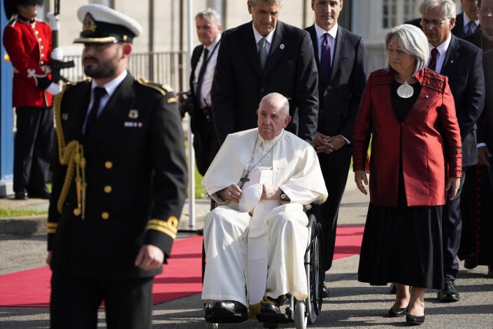 Pope Francis accompanied by Governor-General Mary Simon, right, arrives at the Citadelle de Quebec, Wednesday, July 27, 2022, in Quebec City, Quebec City, Quebec. Pope Francis is on a "penitential" six-day visit to Canada to beg forgiveness from survivors of the country's residential schools, where Catholic missionaries contributed to the "cultural genocide" of generations of Indigenous children by trying to stamp out their languages, cultures and traditions. (AP Photo/John Locher)