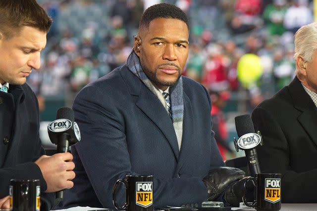 <p>Andy Lewis/Icon Sportswire via Getty </p> Michael Strahan looks on during the Championship game between the San Fransisco 49ers and the Philadelphia Eagles on January 29, 2023