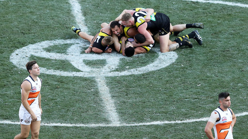 The Tigers, pictured here celebrating their grand final triumph.