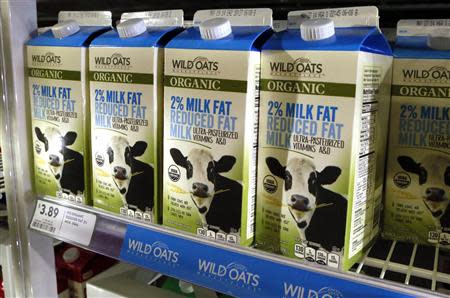 Cartons of milk produced by Wild Oats are seen in a Fresh & Easy store in Palm Springs, California April 9, 2014. REUTERS/Sam Mircovich