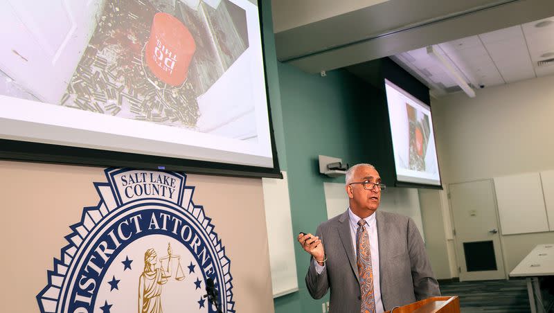 Salt Lake County District Attorney Sim Gill shows a photo of an overturned bucket of ammunition found inside Peter Michael Larsen’s home while talking about a July 9, 2022, officer-involved critical incident involving Larsen during a press conference at the Salt Lake County District Attorney’s Building in Salt Lake City on Friday, May 12, 2023. Gill said the Salt Lake City police officers’ use of deadly force, which did not kill Larsen, was justified. Gill said the ammunition did not weigh on that decision since the officers didn’t know about it until after their use of force. Larsen was shot in both hands.