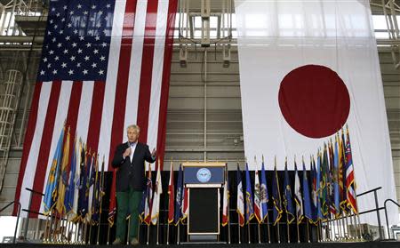 U.S. Defense Secretary Chuck Hagel speaks to U.S. and Japan military personnel stationed at Yokota Air Base on the outskirts of Tokyo April 5, 2014. Hagel moved on Saturday to reassure Japan of America's commitment to its security, as Russia's annexation of Crimea raises eyebrows in a region facing its own territorial disputes with an increasingly assertive China. REUTERS/Toru Hanai