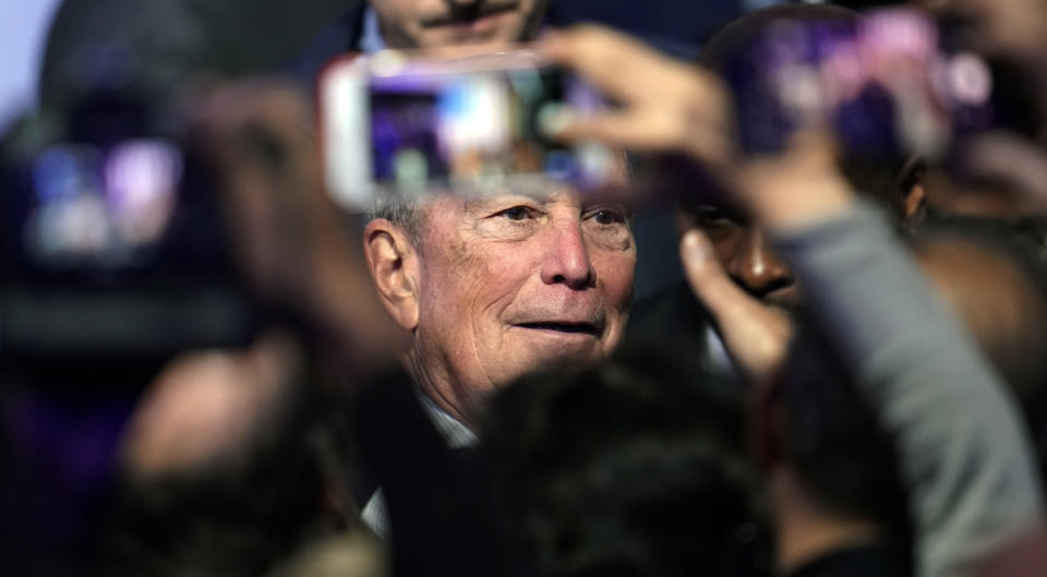 Mike Bloomberg poses for photographs with supporters during his campaign launch of "Mike for Black America" in Houston on Thursday. (AP Photo/David J. Phillip)