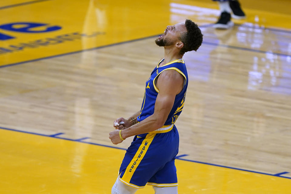 Golden State Warriors guard Stephen Curry reacts after a 3-point shot against the Los Angeles Clippers during the second half of an NBA basketball game in San Francisco, Friday, Jan. 8, 2021. (AP Photo/Tony Avelar)