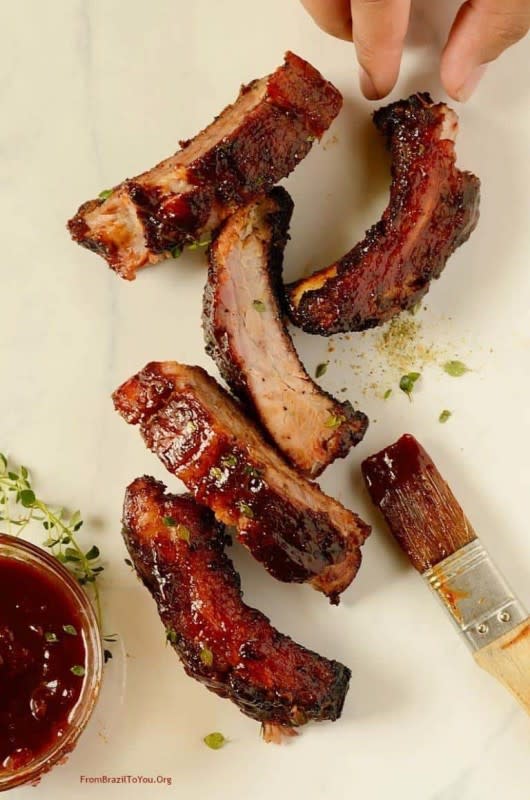 <p>Red Wine Barbecue Pork Ribs are rubbed with brown sugar and a blend of spices, then grilled until tender and basted with a red wine barbecue sauce. <strong>Get the Recipe: <a href="https://www.easyanddelish.com/red-wine-barbecue-pork-ribs/" rel="nofollow noopener" target="_blank" data-ylk="slk:Red Wine Barbecue Pork Ribs;elm:context_link;itc:0;sec:content-canvas" class="link rapid-noclick-resp">Red Wine Barbecue Pork Ribs</a></strong></p>