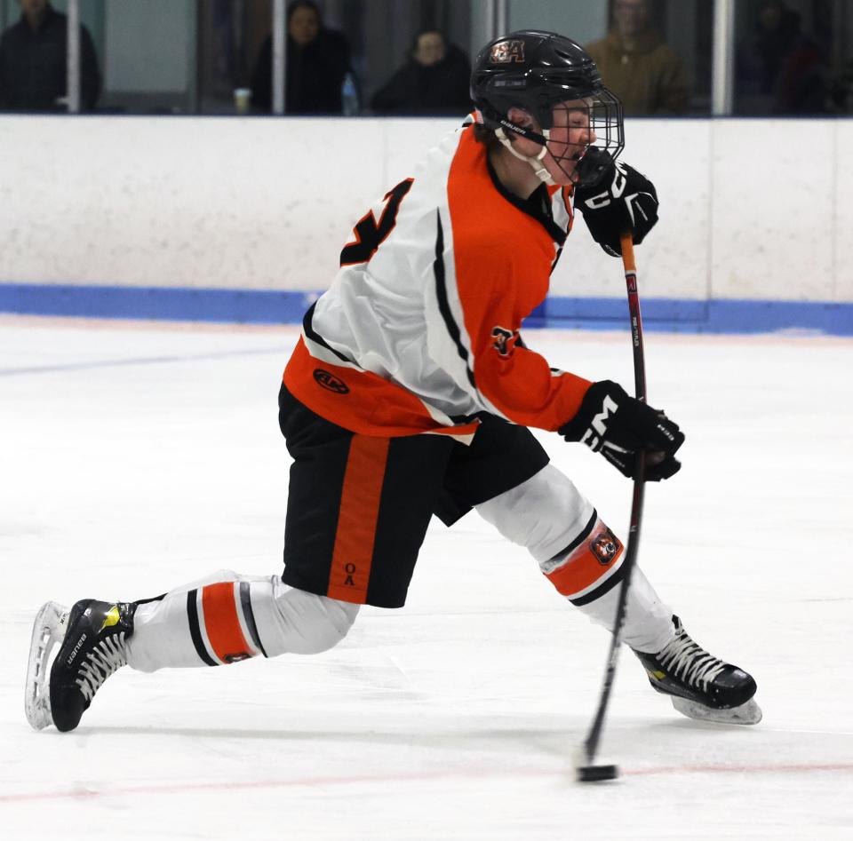 Oliver Ames Matt Lawson takes a shot on the Newton South net during a game on Wednesday, Feb. 14, 2024.