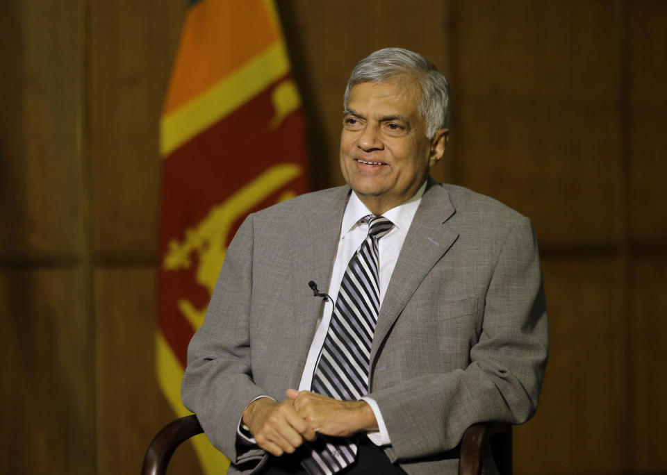 Sri Lankan Prime Minister Ranil Wickremesinghe takes a question during an interview with the Associated Press at his office in Colombo, Sri Lanka, Thursday, April 25, 2019. Wickremesinghe has acknowledged to The Associated Press that minority Ahmadi Muslims who are refugees from Pakistan have faced attacks since the Easter bombings. He said Thursday that security forces were trying to help the Ahmadis. (AP Photo/Eranga Jayawardena)