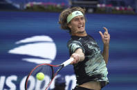 Alexander Zverev, of Germany, returns a shot to Frances Tiafoe, of the United States, during the second round of the US Open tennis championships Thursday, Aug. 29, 2019, in New York. (AP Photo/Kevin Hagen)