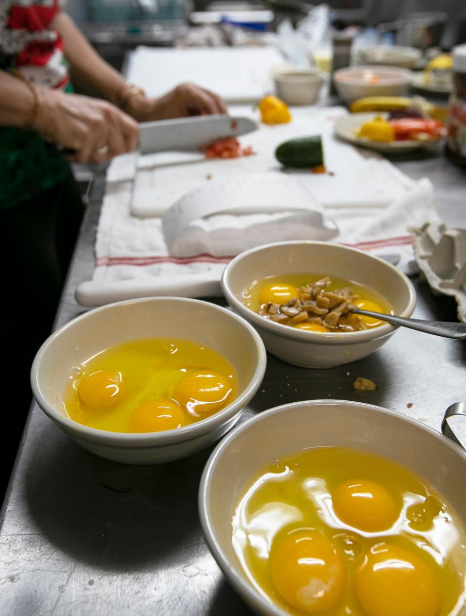 Cafe co-owner Madlen Koenig Halbritter prepares breakfast omelets at the new Art Cafe which recently opened its doors on Chiquita Boulevard in Cape Coral.