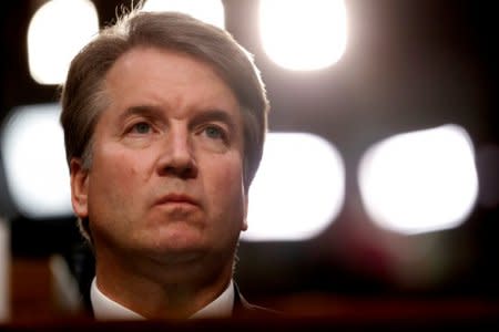 FILE PHOTO: U.S. Supreme Court nominee Judge Brett Kavanaugh listens during his U.S. Senate Judiciary Committee confirmation hearing on Capitol Hill in Washington, U.S., September 4, 2018. REUTERS/Joshua Roberts/File Photo