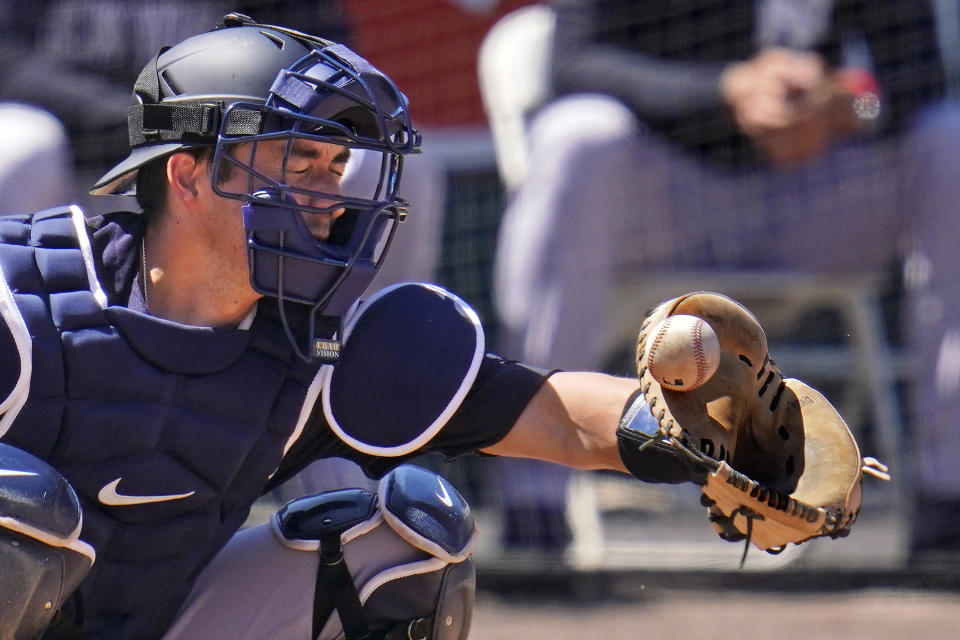 New York Yankees catcher Kyle Higashioka can't handle a pitch from Corey Kluber during the third inning of a spring training exhibition baseball game against the Detroit Tigers in Lakeland, Fla., Tuesday, March 23, 2021. (AP Photo/Gene J. Puskar)