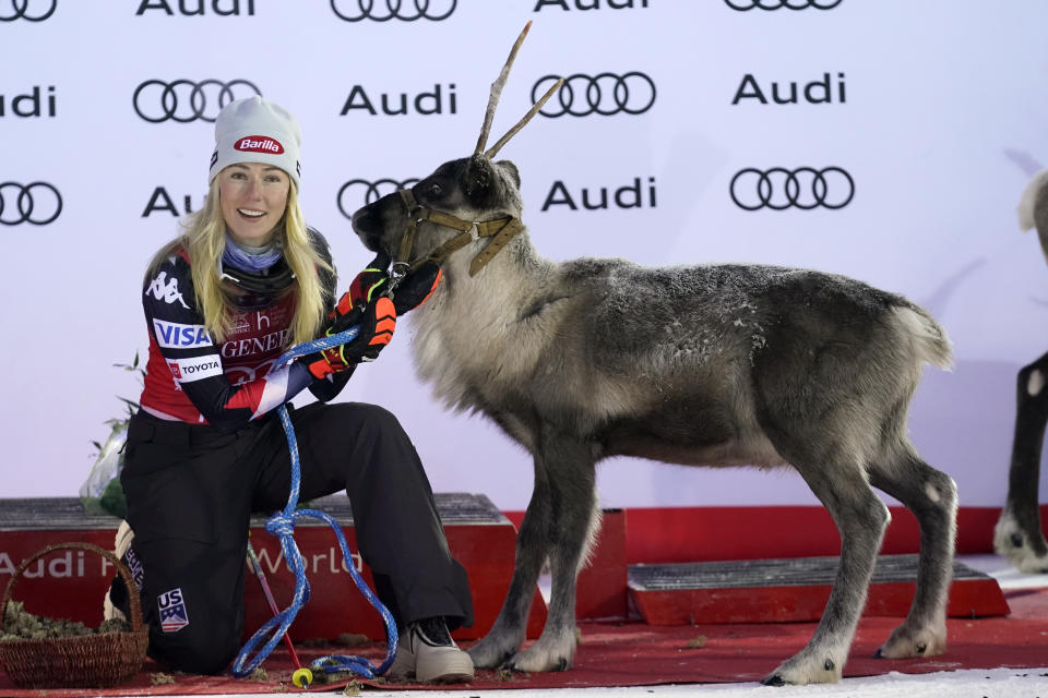 United States' Mikaela Shiffrin is given a reindeer after winning an alpine ski World Cup women's slalom race, in Levi, Finland, Sunday, Nov. 12, 2023. (AP Photo/Giovanni Auletta)