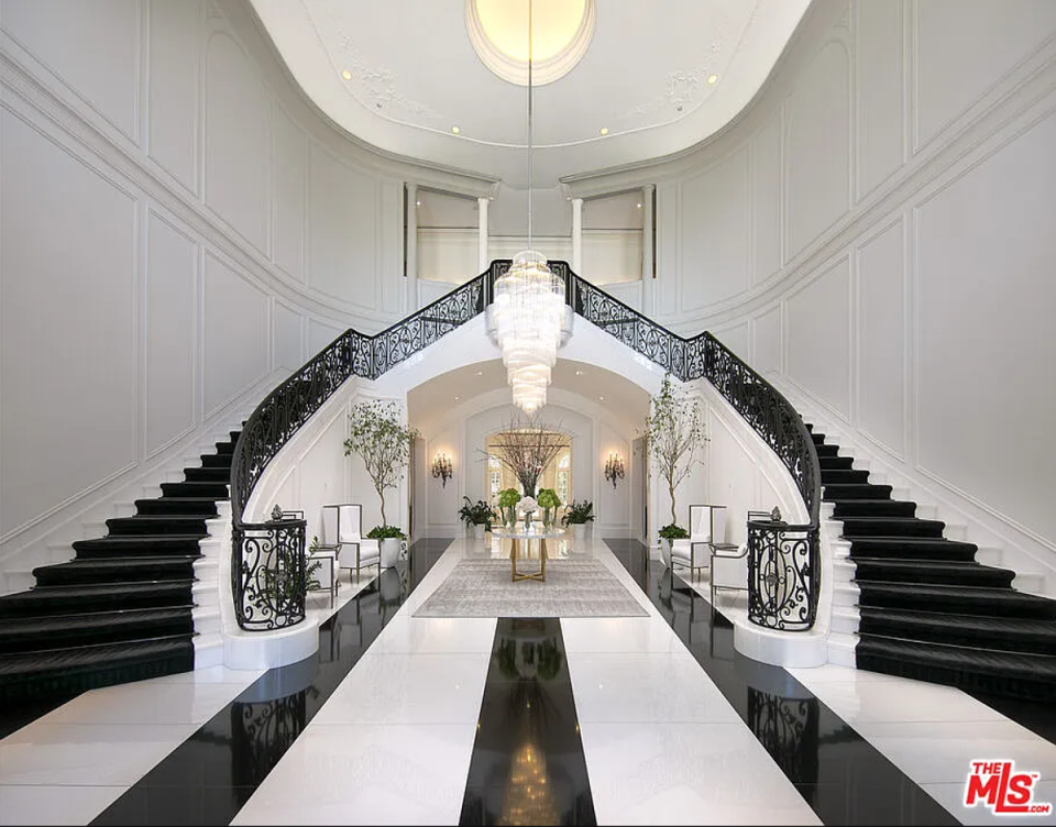 The double staircase in the entrance hall (Zillow)