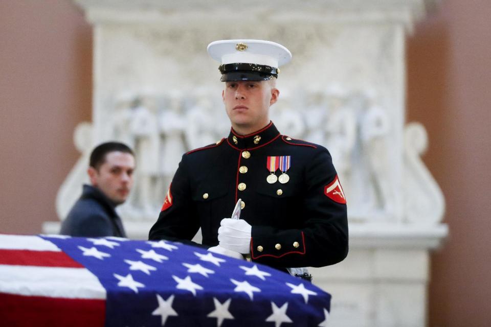 Marines stand guard over the casket of John Glenn as he lies in honor, Friday, Dec. 16, 2016, in Columbus, Ohio. Glenn's home state and the nation began saying goodbye to the famed astronaut who died last week at the age of 95. (AP Photo/John Minchillo)