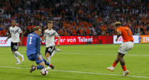 Netherland's Memphis Depay, right, scores his side's second goal against Germany's keeper Manuel Neuer during the UEFA Nations League soccer match between The Netherlands and Germany at the Johan Cruyff ArenA in Amsterdam, Saturday, Oct. 13, 2018. (AP Photo/Peter Dejong)