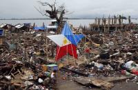 A giant Christmas lantern is seen in a devastated area of Magallanes town, Tacloban city, central Philippines December 22, 2013. Super typhoon Haiyan reduced almost everything in its path to rubble when it swept ashore in the central Philippines on November 8, killing at least 6,069 people, leaving 1,779 missing and 4 million either homeless or with damaged homes. REUTERS/Romeo Ranoco (PHILIPPINES - Tags: DISASTER ENVIRONMENT)