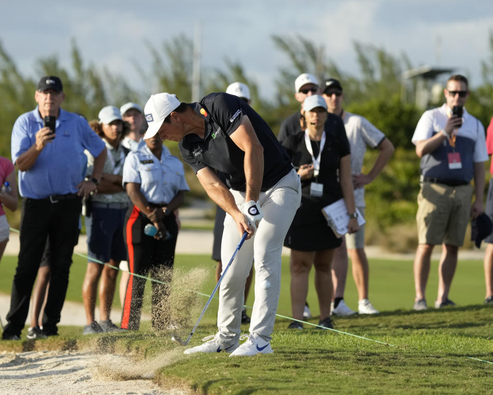 Viktor Hovland, of Norway, hits from the rough at the 16th hole during the first round of the Hero World Challenge PGA Tour at the Albany Golf Club, in New Providence, Bahamas, Thursday, Dec. 1, 2022. (AP Photo/Fernando Llano)