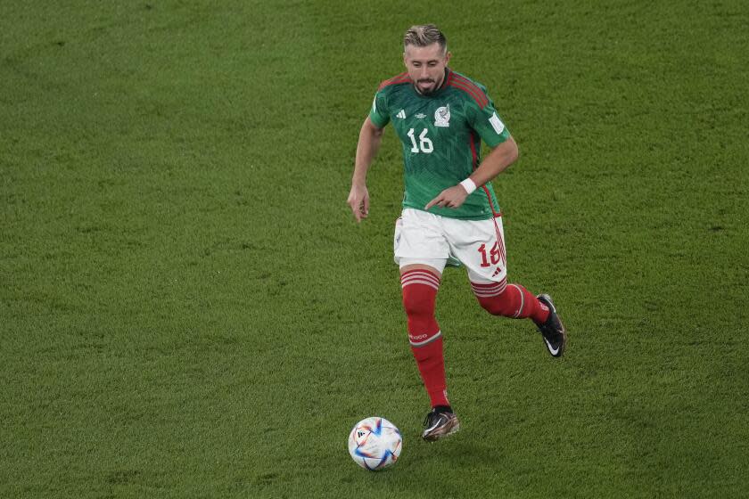 Mexico's Hector Herrera controls the ball during the World Cup group C soccer match between Mexico and Poland, at the Stadium 974 in Doha, Qatar, Tuesday, Nov. 22, 2022. (AP Photo/Darko Vojinovic)