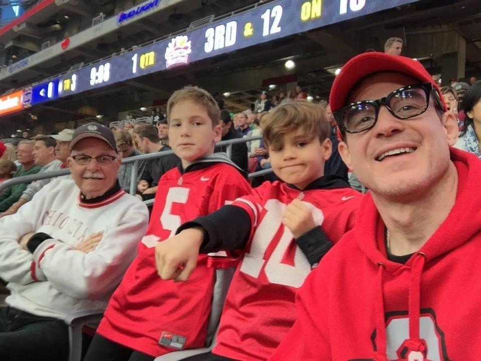 Eddie McClintock, right, is shown with his sons and his late father, Ted McClintock. North Canton native Eddie McClintock, a TV and film actor, has dedicated his new movie, "Miracle at Manchester" to his dad.