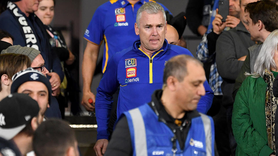 Adam Simpson walks down to the ground from the coaches box.