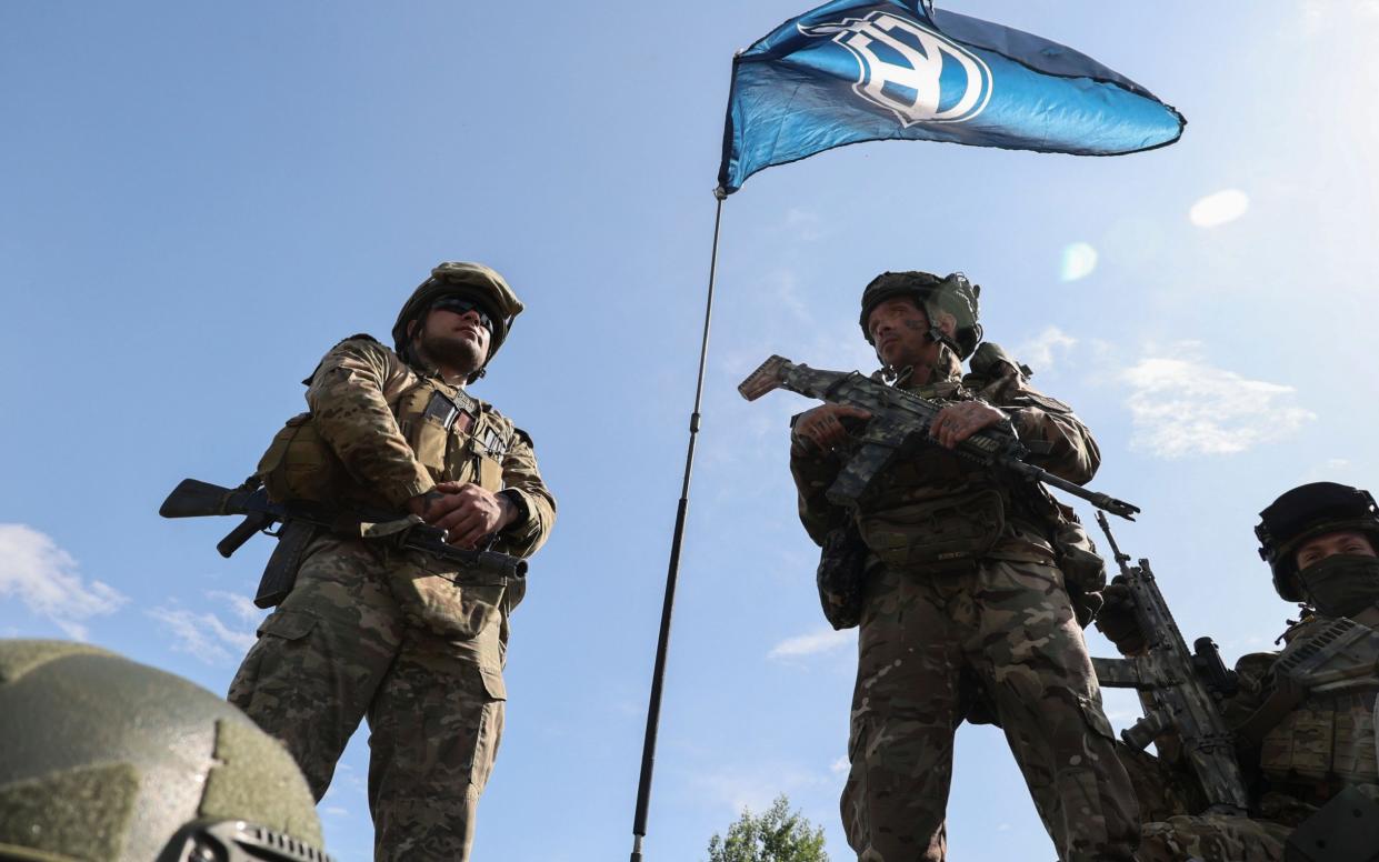 Members of the 'Russian Volunteer Corps' and 'Freedom of Russia Legion' hold a meeting with the media not far from the Ukraine-Russia border in Kharkiv's area, northeastern Ukraine