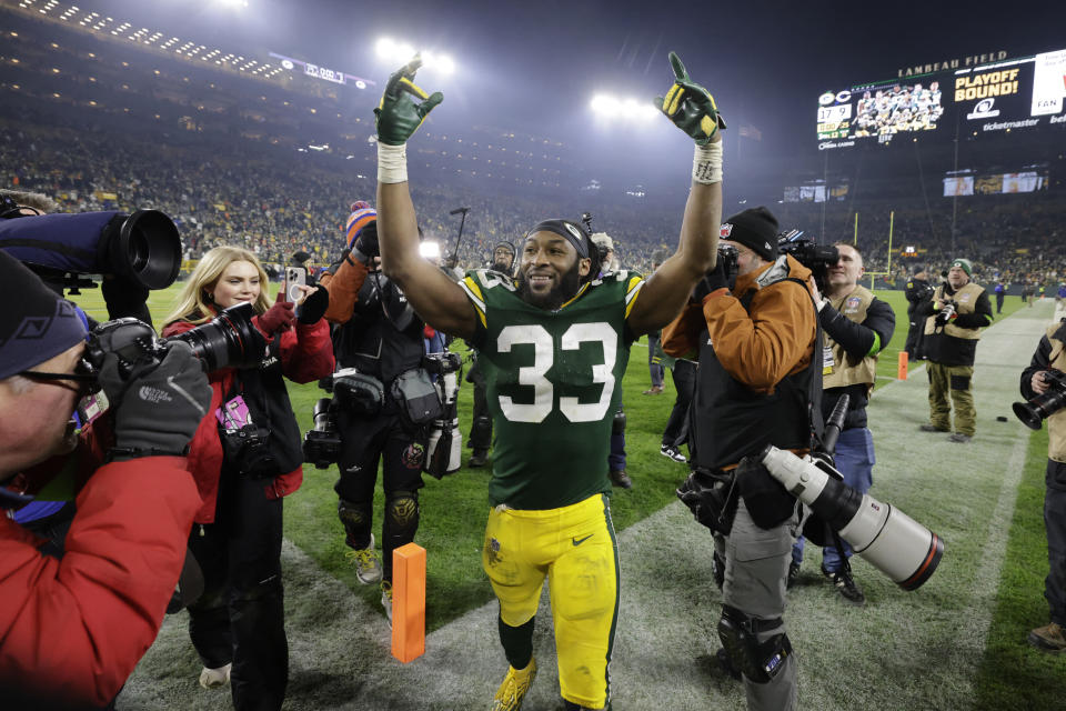 Green Bay Packers running back Aaron Jones (33) celebrates following an NFL football game against the Chicago Bears Sunday, Jan. 7, 2024, in Green Bay, Wis. The Packers won 17-9. (AP Photo/Mike Roemer)