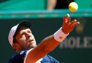 Tennis - Monte Carlo Masters - Monaco, 19/04/2017. Gilles Muller of Luxemburg serves to Andy Murray of Britain. REUTERS/Eric Gaillard