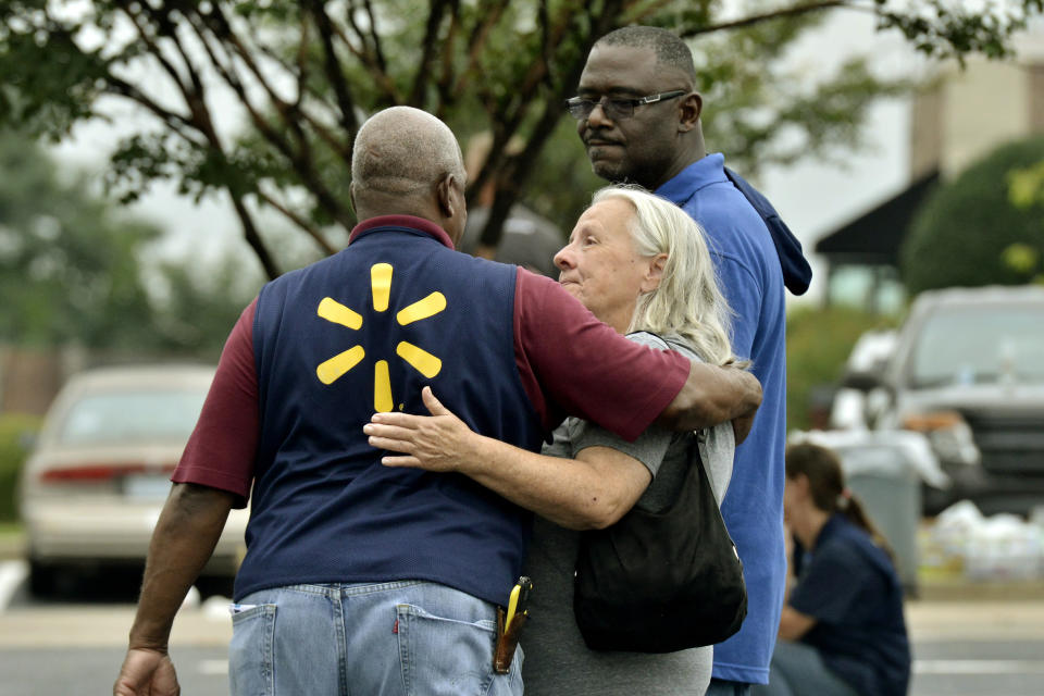 People console one another after a shooting at a Walmart store Tuesday, July 30, 2019 in Southaven, Miss. (Photo: Brandon Dill/AP)