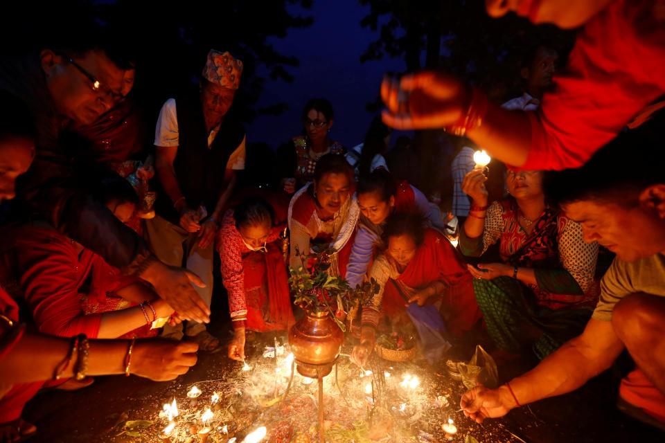<p>Devotees offer lamps as part of a ritual during “Dashain”, a Hindu religious festival in Bhaktapur, Nepal, Sept. 30, 2017. (Photo: Navesh Chitrakar/Reuters) </p>