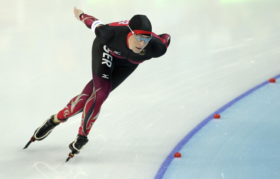 Claudia Pechstein of Germany competes in the women's 3,000-meter speedskating race at the Adler Arena Skating Center during the 2014 Winter Olympics, Sunday, Feb. 9, 2014, in Sochi, Russia. (AP Photo/Pavel Golovkin)