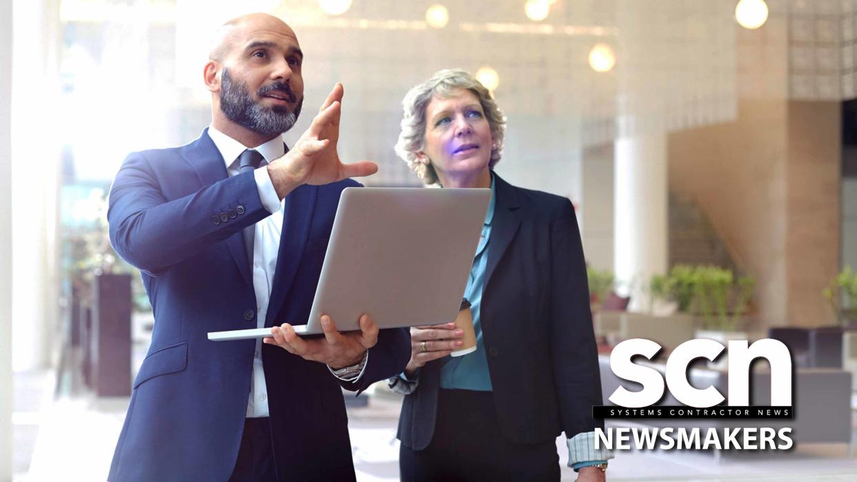  A man and a women ponder the future looking at a laptop screen. . 