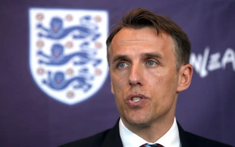 New England Women head coach Phil Neville speaks to the media during his official unveiling at St George's Park - Credit:  PA