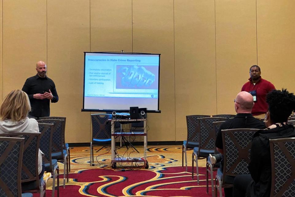 Cpls. Chris Holder and Jastin Williams present their hate crimes training at the International Law Enforcement Educators and Trainers Association Conference & Expo in St. Louis on March 21, 2023. <cite>Credit: Courtesy of Arlington Police Department</cite>